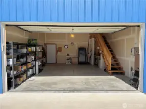 Interior of garage. The stairway leads to the upper levels, perfect for guests.