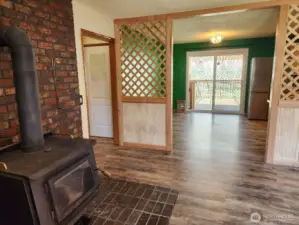 Free standing stove off dining room and kitchen