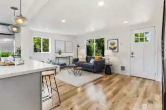 Spacious living room with gleaming floors.