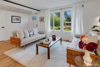 The open floor plan allows for easy entertaining. The door on the left is a large coat closet.