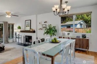 The dining area easily accommodates a Thanksgiving crowd or an intimate dinner party with friends. Large windows look out to the built-in garden beds ready for your flower garden or veggie patch.