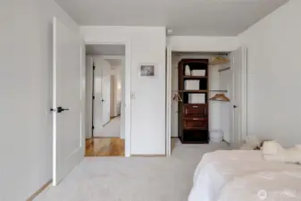 Second bedroom off the main hall with a built-in closet unit, new paint and carpet.