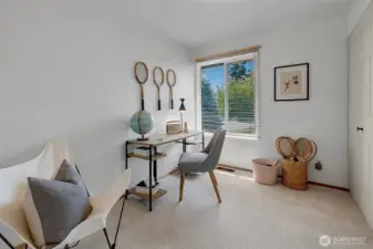 One of 3 bedrooms off the main hallway with a large closet and new carpet. There are oak hardwood floors under the carpet.