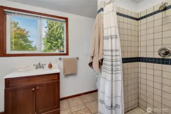 ¾ tiled bath adjacent to the laundry room.