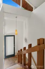 The materials in this beauty!  Slate flooring, artisan crafted railings and cork lined stairs combine with lofted ceilings and bespoke lighting.