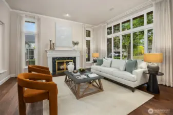 Wide-plank hardwoods grace the main level, adding warmth and sophistication to the home’s open, inviting design.