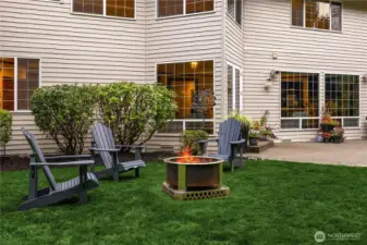 The quiet, park-like backyard backs to private green space and features a large patio and Breeo smokeless fire pit for nights under the stars.