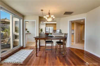 The dining area is perfectly positioned to enjoy meals with a view, seamlessly connected to the kitchen and living room.