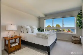 Wake up to incredible views from the large, bright windows in the freshly updated primary bedroom.