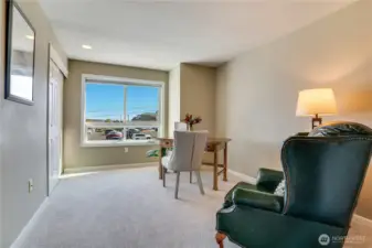 The second bedroom features new carpet, a large window for natural light, and a spacious closet.