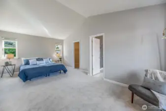 At the top of the stairs you will find the oversized primary suite, with sitting area