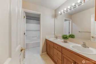 Dual sink bathroom with privacy door upstairs