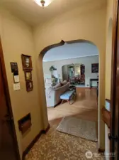 Looking from the entry to the living room- so nice to not walk directly into living space.  And the wood trimmed mail slot means your mail stays dry and safe.