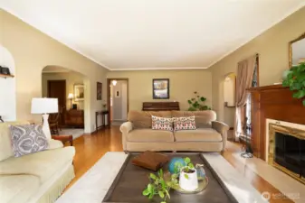 To the right is the entrance, straight ahead is the hallway taking you to two bedrooms and a full bath.  The arch on the left takes you to your formal dining area.