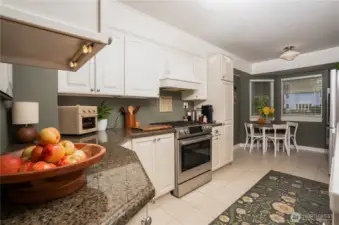 The kitchen is often the heart of the home and this one is no different. Simple, understated, charming, and functional.  What a fab combo. And, the eating area, with natural light, is a wonderful place for a morning cup of joe or an informal meal.