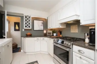 An oversized Bosch gas range and stove makes cooking, even for crowds, a breeze.  Door leads to the lower level, but we're going to continue to the rest of the main floor.  Fabulous lower level to be continued.