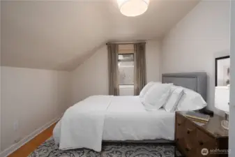 One of the five bedrooms, this one is located on the second floor.