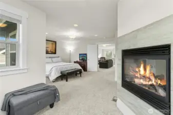 Primary Ste includes of private sitting with fireplace
