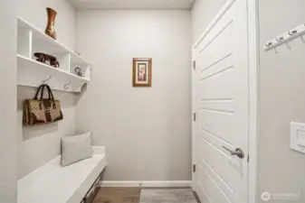 Mudroom with bench off garage