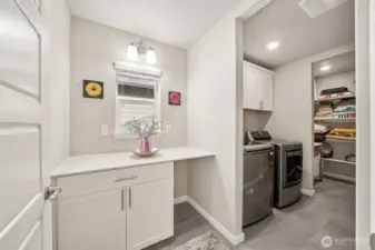 Enormous laundry room with attached linen closet