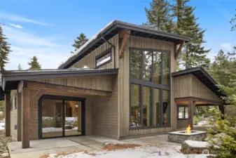 Back of home view with slider from primary bedroom