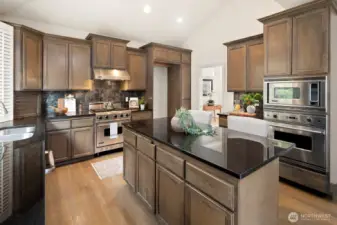 Vaulted ceilings grace this beautiful kitchen.