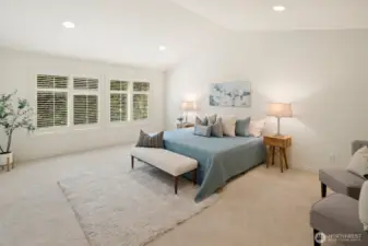 Grand primary suite with gorgeous private backyard views and vaulted ceilings!