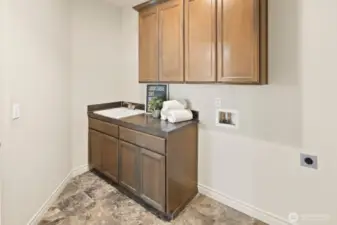 Downstairs laundry off garage entry.