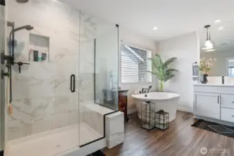 Large shower with upgraded tile with tile detail.