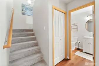 Powder room and stairs to upper level.