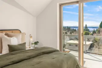 sliding doors lead to private deck w/ view of the mountains and sound!