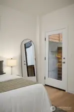 Guest bedroom has access to private outside patio.