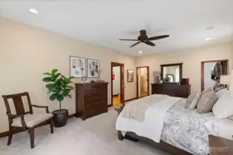 Primary suite on MAIN floor features a walk-in closet and full bathroom.