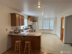 Nice Big Kitchen with Eating Nook and Breakfast Counter. Plenty of Cabinets and Storage. All Appliances Stay with the Home.