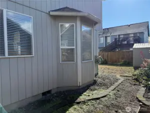Side Yard View of Home and Garden Shed