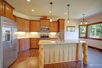 Custom designed island in the kitchen is warm and inviting