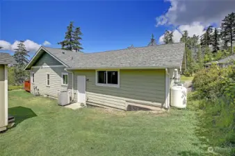 South side of the property leading to one of the two storage sheds.  Plenty of room for a garden with a lot of natural sunlight