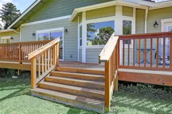 Large cedar deck leading to your .46 acre lot