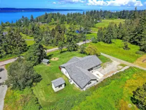 This is an aerial view facing Northwest, lots of privacy and located to several walking trails leading to the beach and Cama Beach State Park