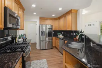 Chef's kitchen with newer, SMART, stainless steel appliances.