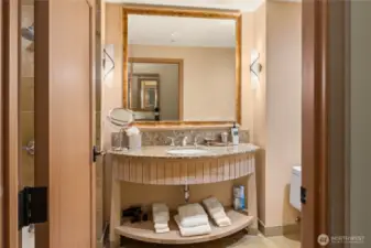 Vanity in bathroom with all the supplies.