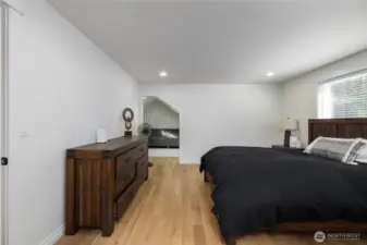 A view toward the cozy adjoining room in the primary suite