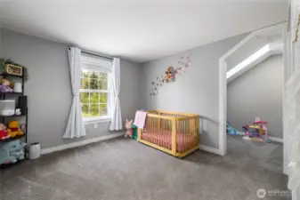 Bedroom #2.  To the right, note the extra nook space, perfect for a study nook or separate play area