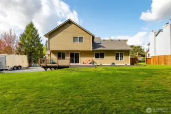 A view of the back of the house from deep in the yard