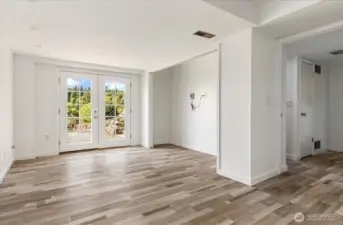 French doors open out to spacious yard.