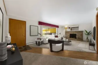 Come on in! The formal living room features a wood burning fireplace. Virtually staged.