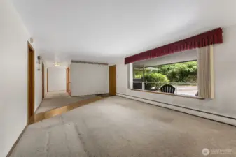 Step out of the kitchen and utility room to the large hallway that leads to the bedrooms.