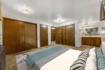 Primary bedroom features double closets and built ins. Virtually staged.