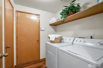 Laundry room and door leading to the garage