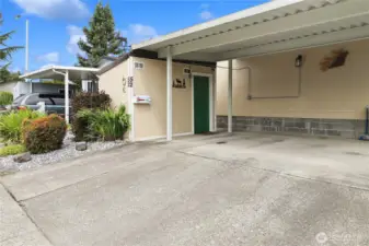 Double car carport provides covered parking, complemented by a storage shed with plenty of room for tools, lawn care, and extra storage.